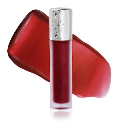 A tube of red liquid lipstick with a silver cap, displayed next to a smeared sample of the color.