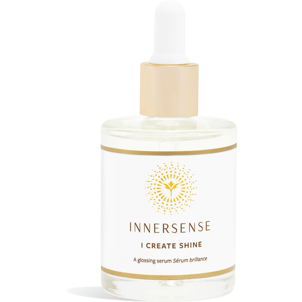 A bottle of innersense glossing serum on a white background.