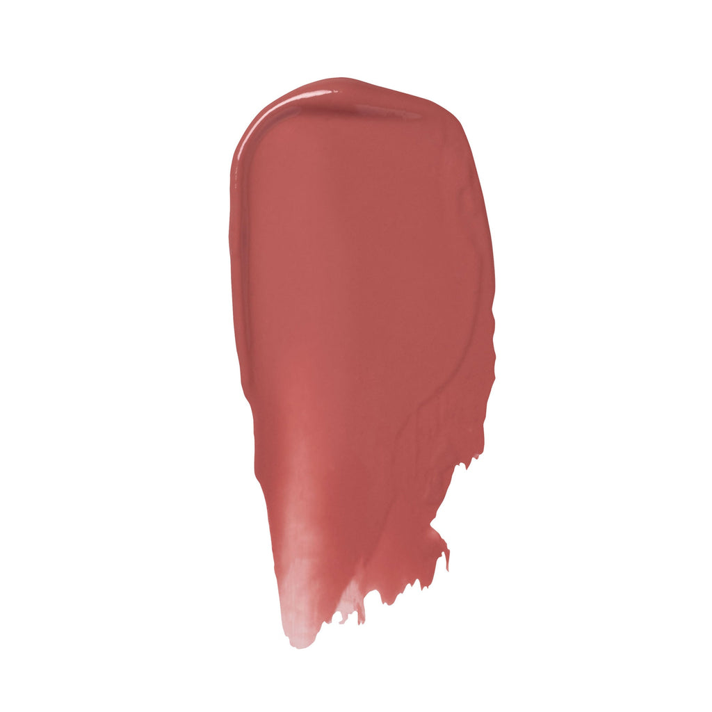 A swatch of red lipstick smeared against a white background.