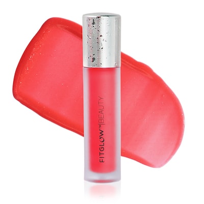 A tube of fitglow beauty lip gloss with its cap placed to the side, isolated on a white background.