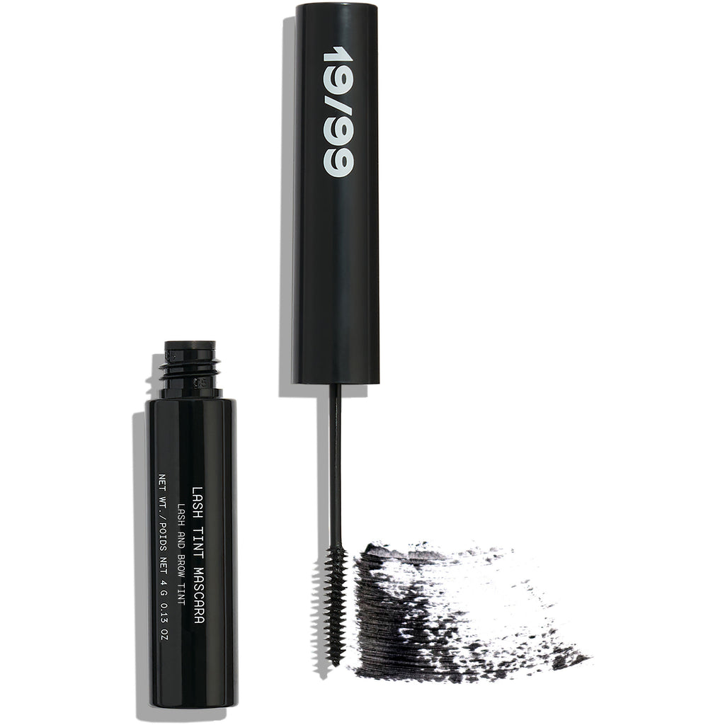 Black mascara with applicator brush and a smear of mascara product.