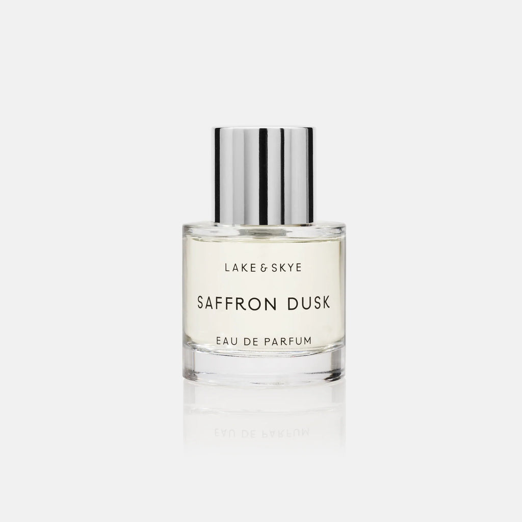A bottle of lake & skye "saffron dusk" eau de parfum against a white background.
