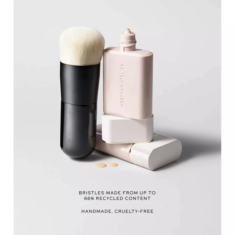 Makeup brush and foundation with sustainable and cruelty-free messaging.
