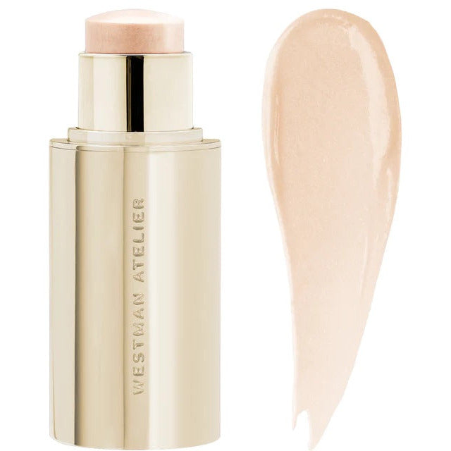 A swatch of cream foundation beside its stick container.