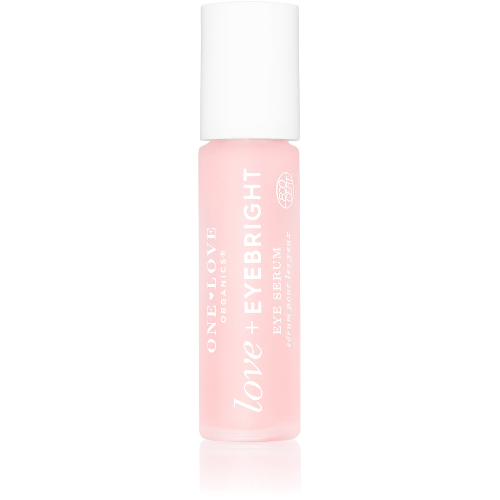 Pink liquid cosmetic product in a clear bottle with white cap and labeled "love bright.