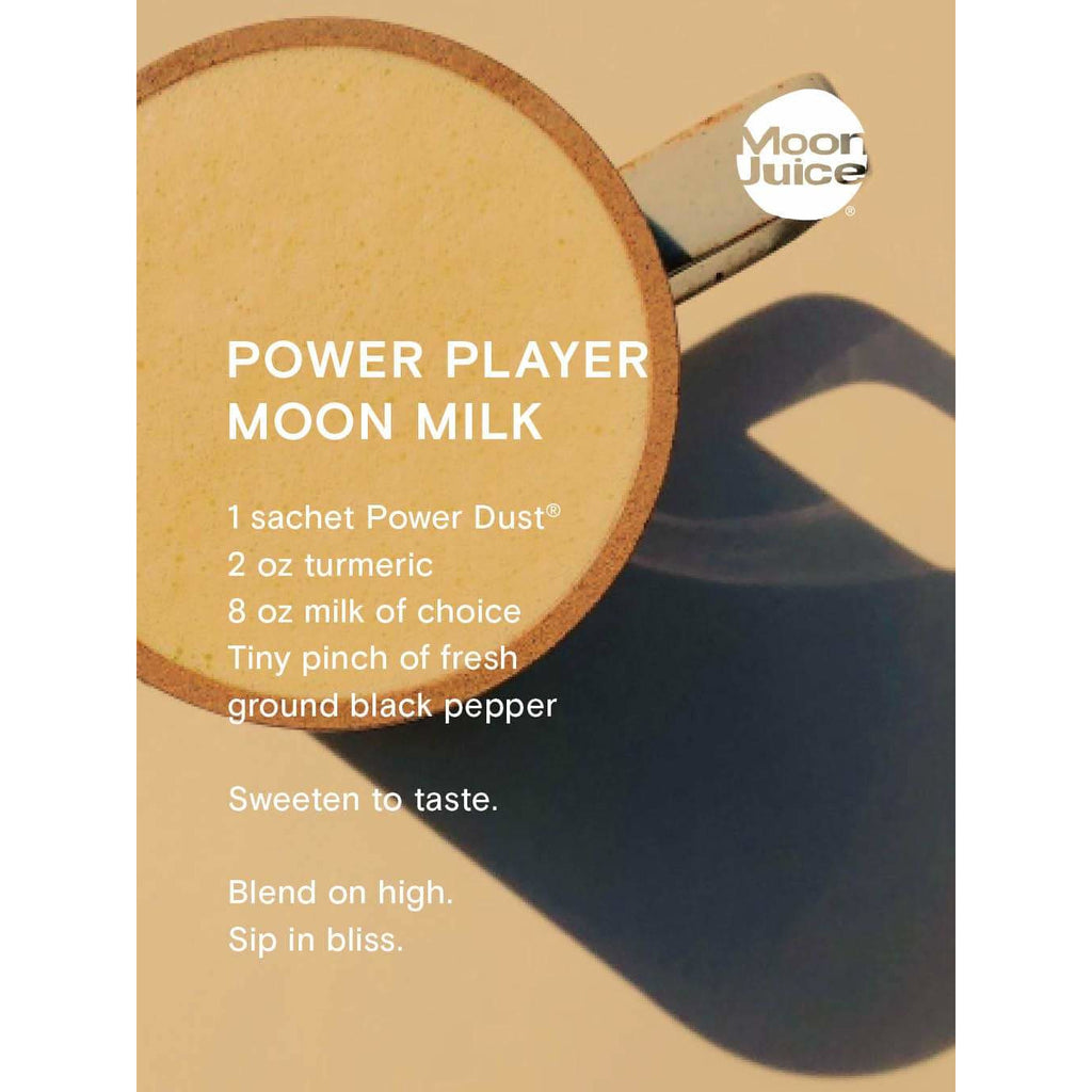 Promotional image for moon juice's "power player moon milk" with a recipe, casting a shadow on a beige background.