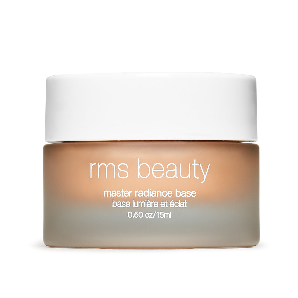A jar of "rms beauty master radiance base" cosmetic product on a white background.