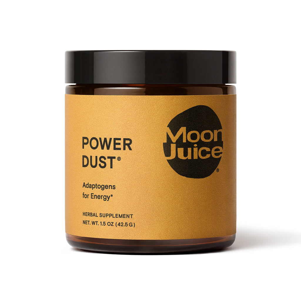 A jar of "power dust" herbal supplement by moon juice, advertised for energy.