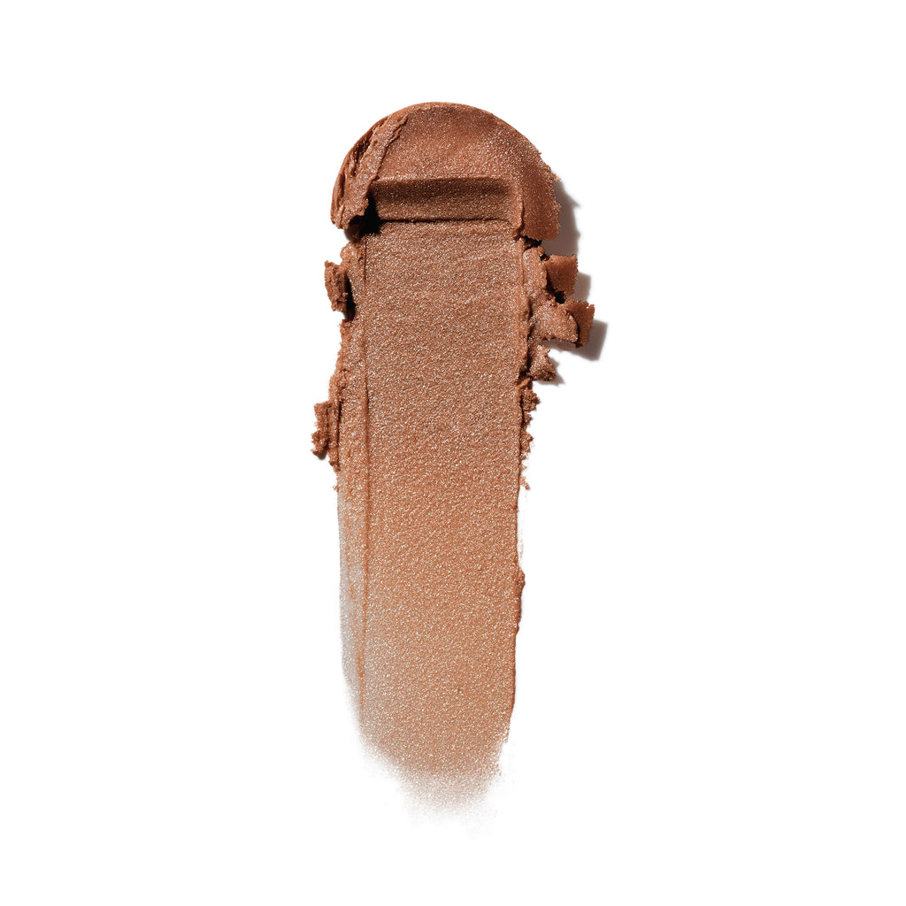 A swatch of crushed brown eyeshadow isolated on a white background.