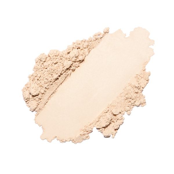 A smear of loose powder foundation isolated on a white background.