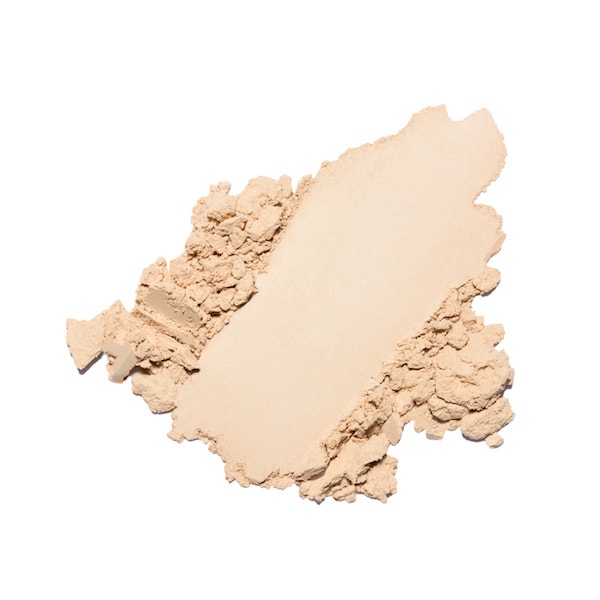 Smear of beige face powder makeup isolated on white background.