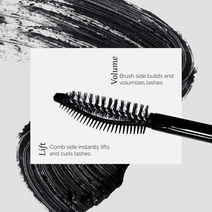 Dual-function mascara wand with volume and lift features against a black brush stroke background.