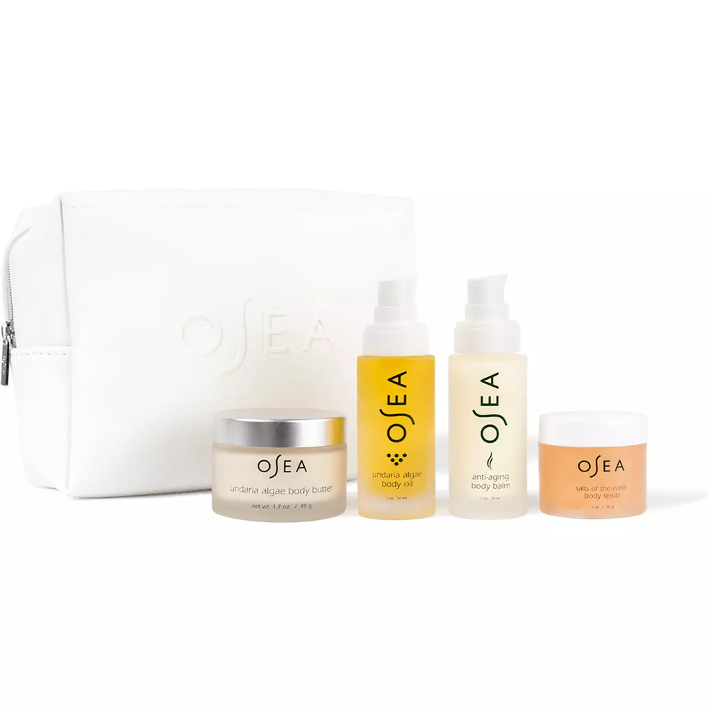 A set of osea skincare products including body balm, mist, and creams displayed alongside a white cosmetic bag.