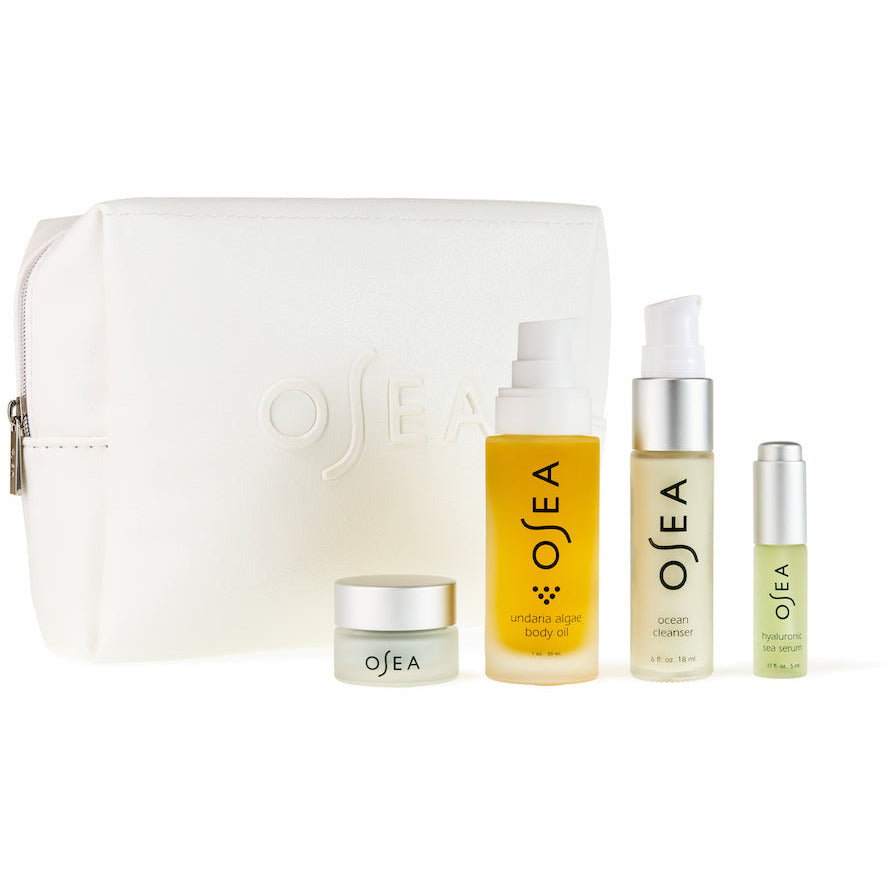 A collection of osea skincare products with a branded cosmetic bag.