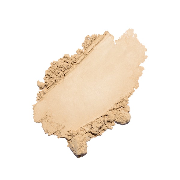 Swatch of crushed beige powder makeup against a white background.
