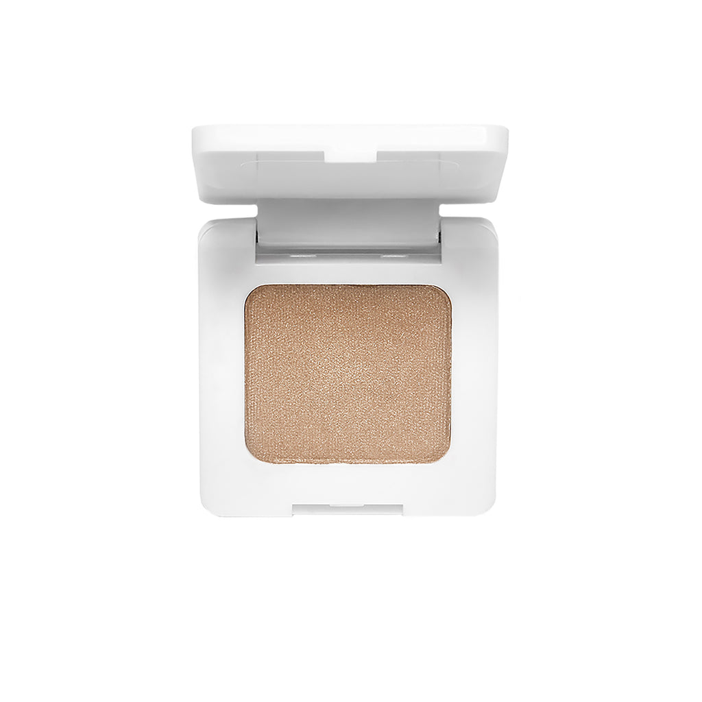 A single eyeshadow in a compact case, displaying a shimmering neutral tone.