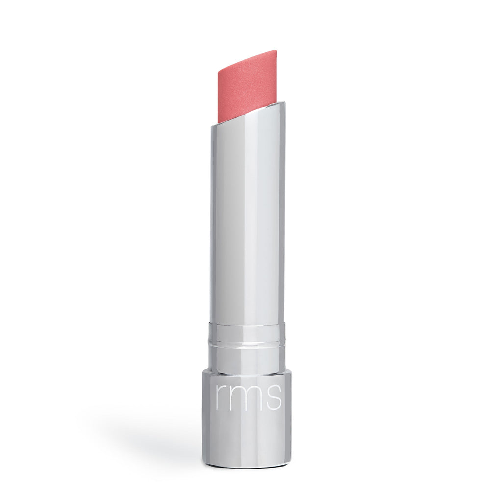 A tube of pink lipstick with its cap off, isolated on a white background.