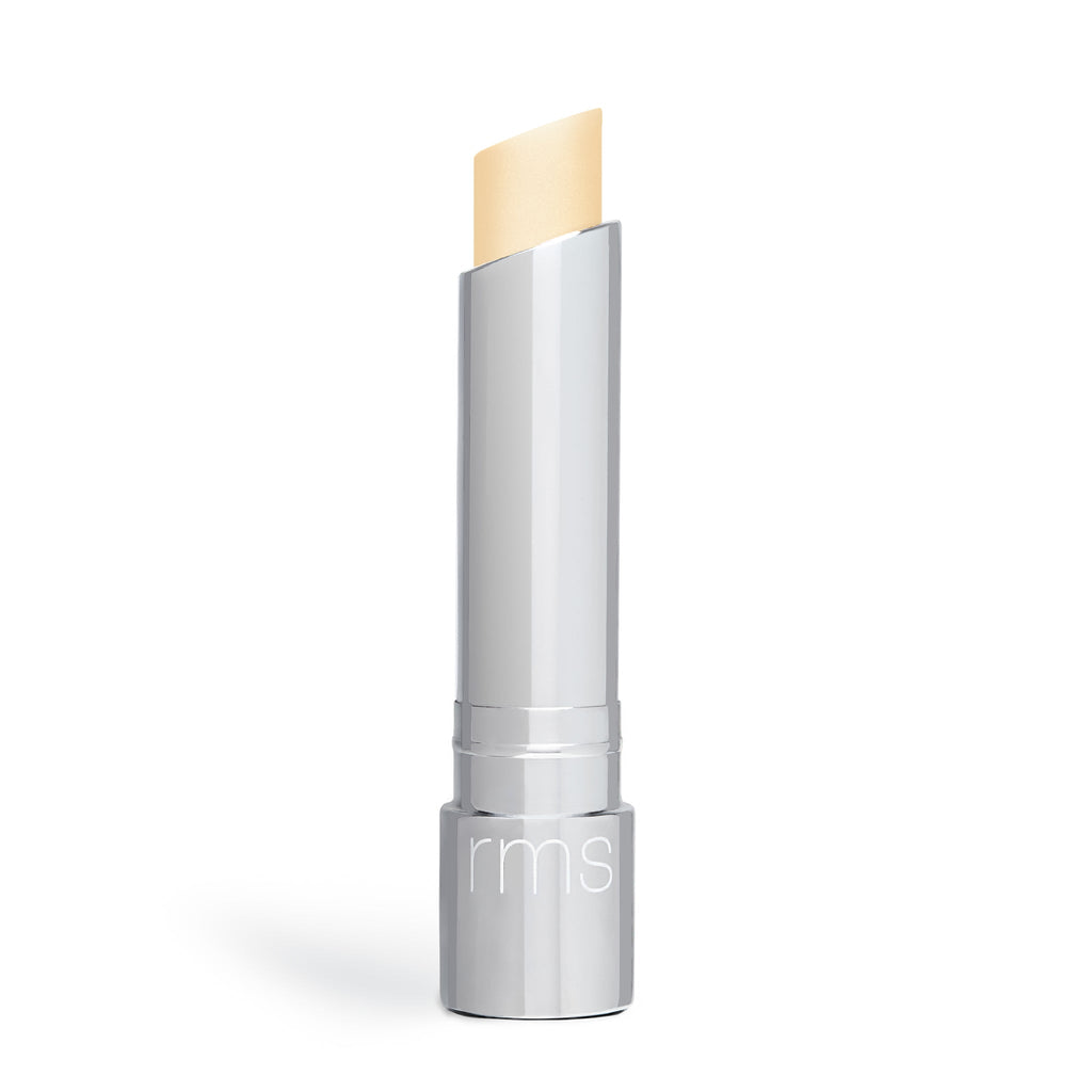 A stick of concealer makeup with the cap off, isolated on a white background.