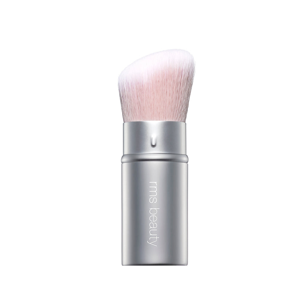 Silver-handled makeup brush with pink bristles.