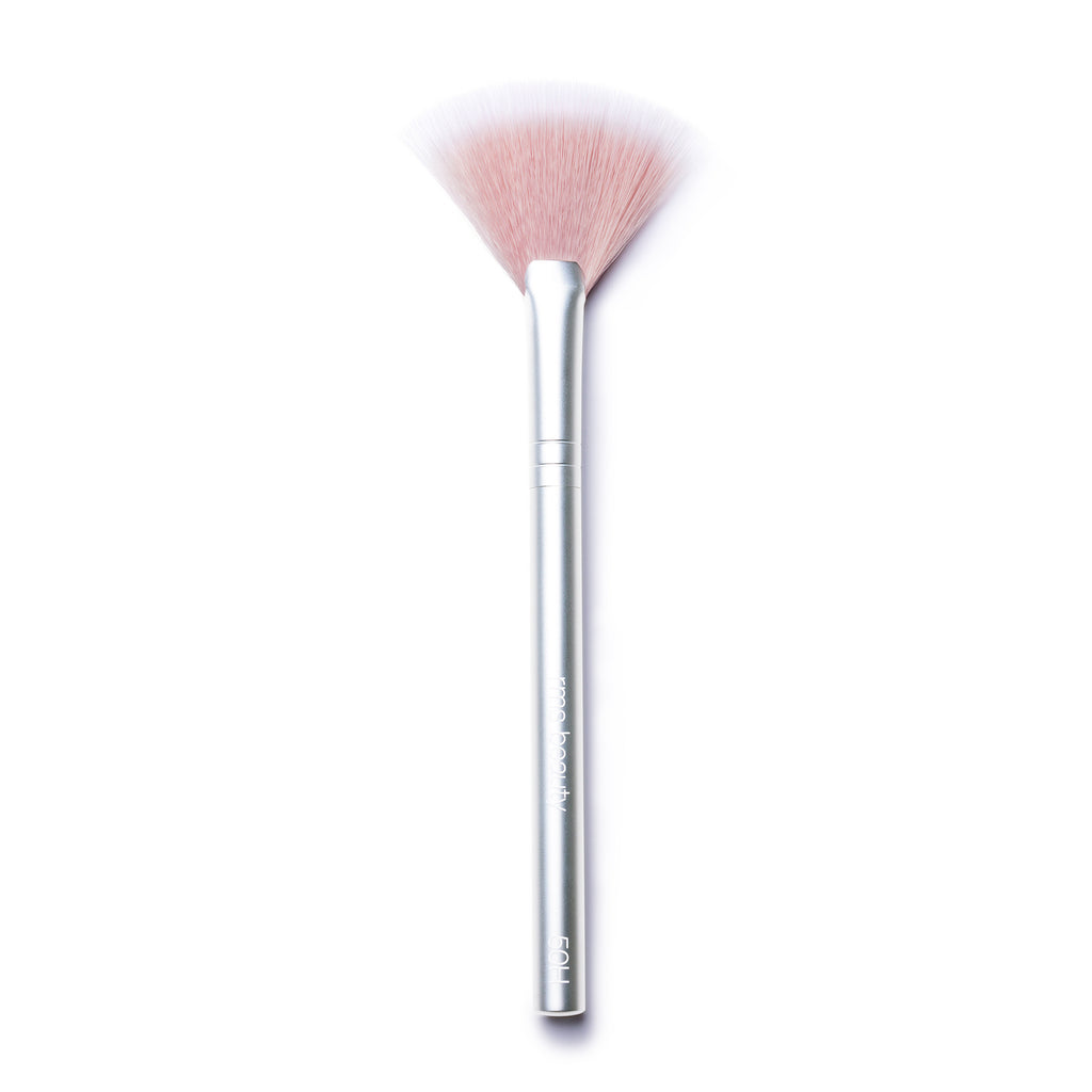 A fan makeup brush with a silver handle isolated on a white background.