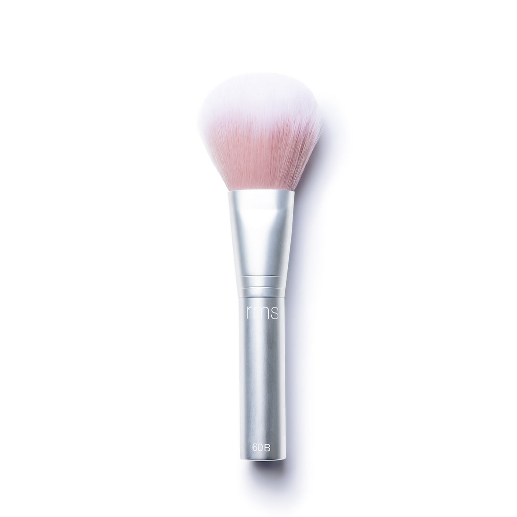 A single makeup brush with a silver handle against a white background.