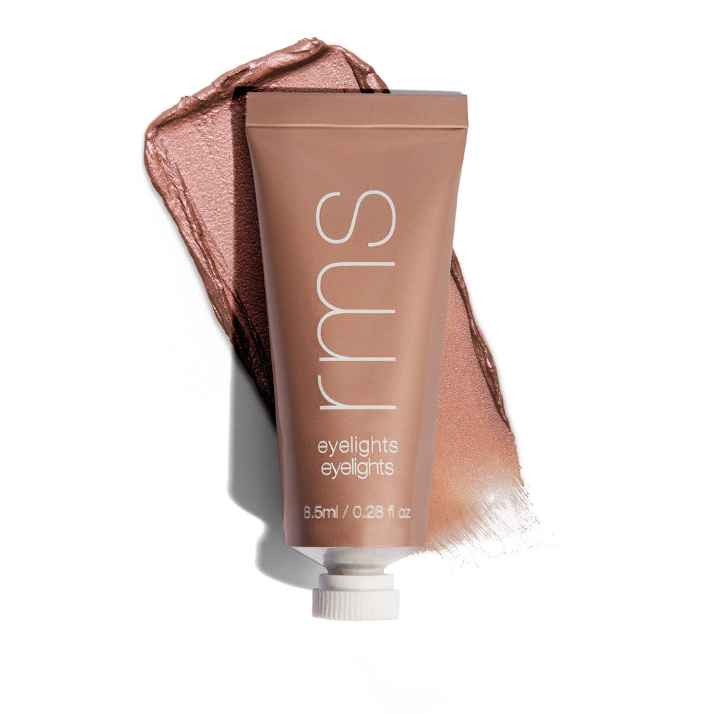Cosmetic cream tube with a swatch of the product on a white background.