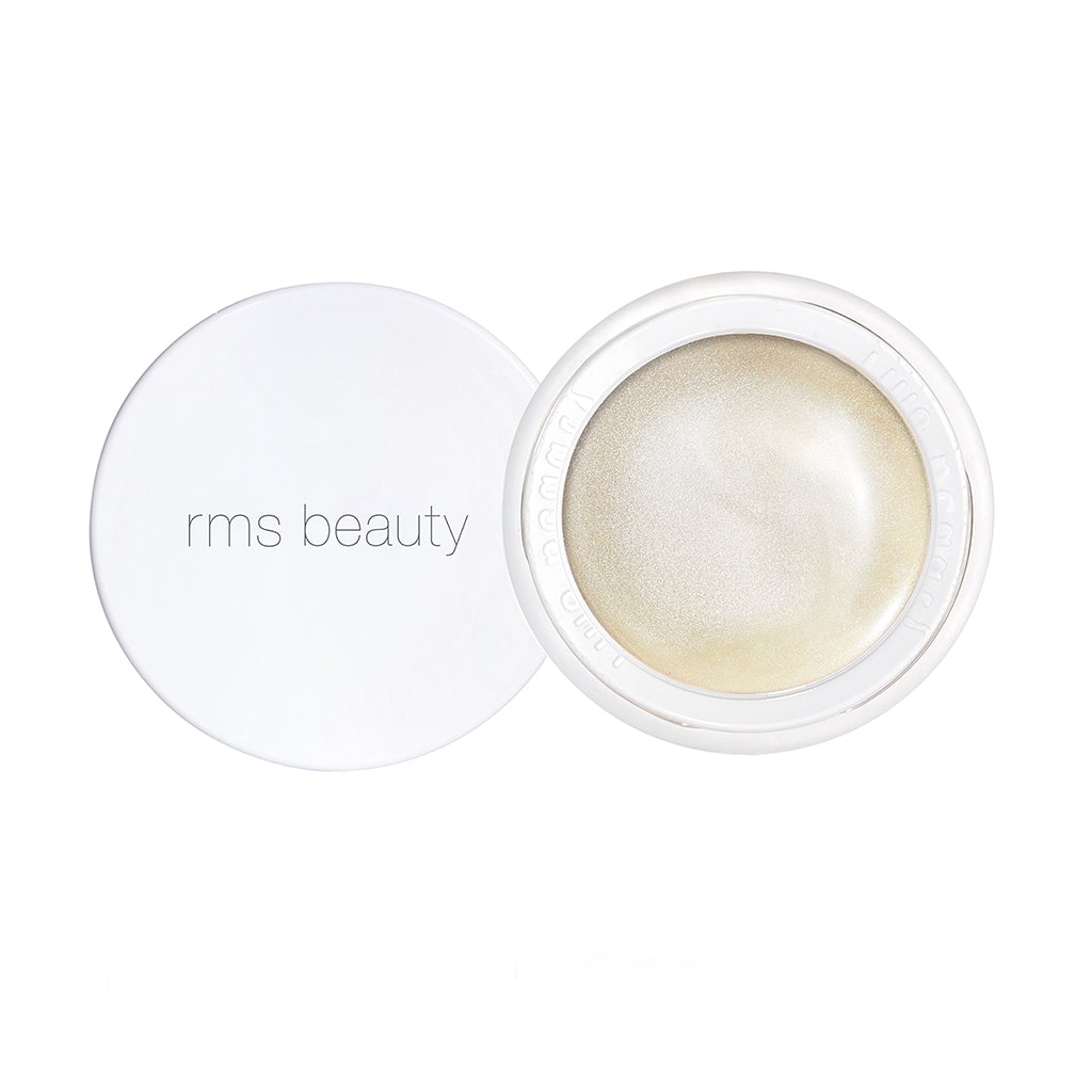 Open container of rms beauty highlighter with a shimmery product.