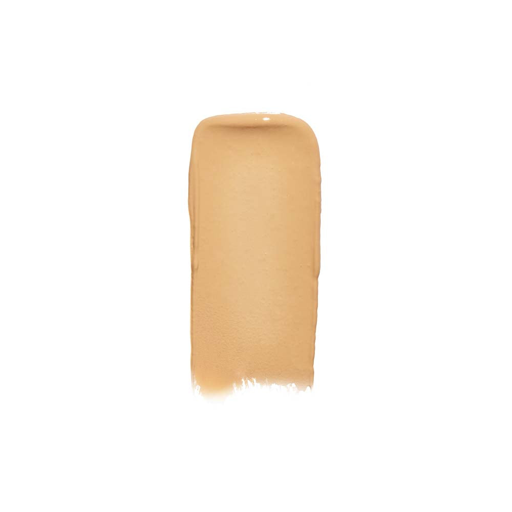 A swatch of liquid foundation makeup on a white background.