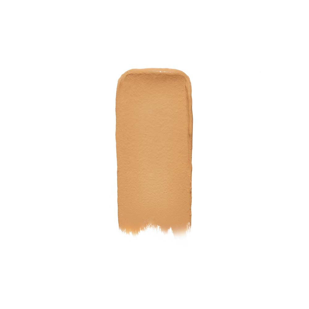 A swatch of beige foundation makeup on a white background.