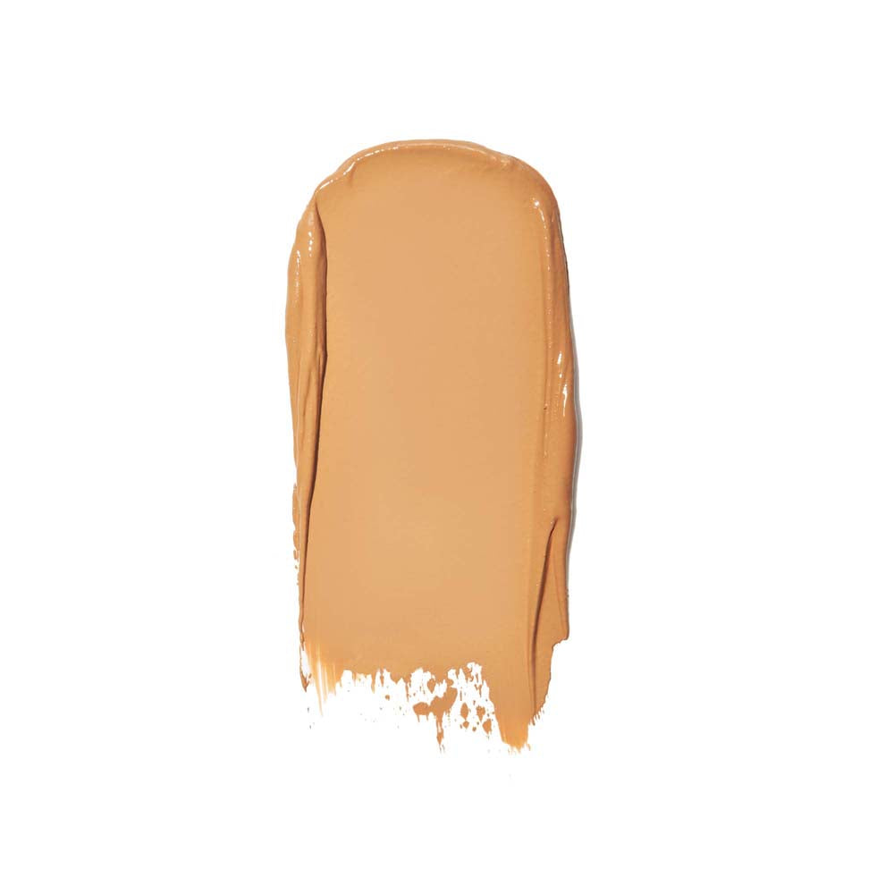 A swatch of liquid foundation makeup against a white background.