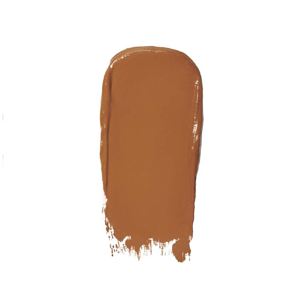 A swatch of brown creamy substance, possibly makeup foundation, smeared on a white background.