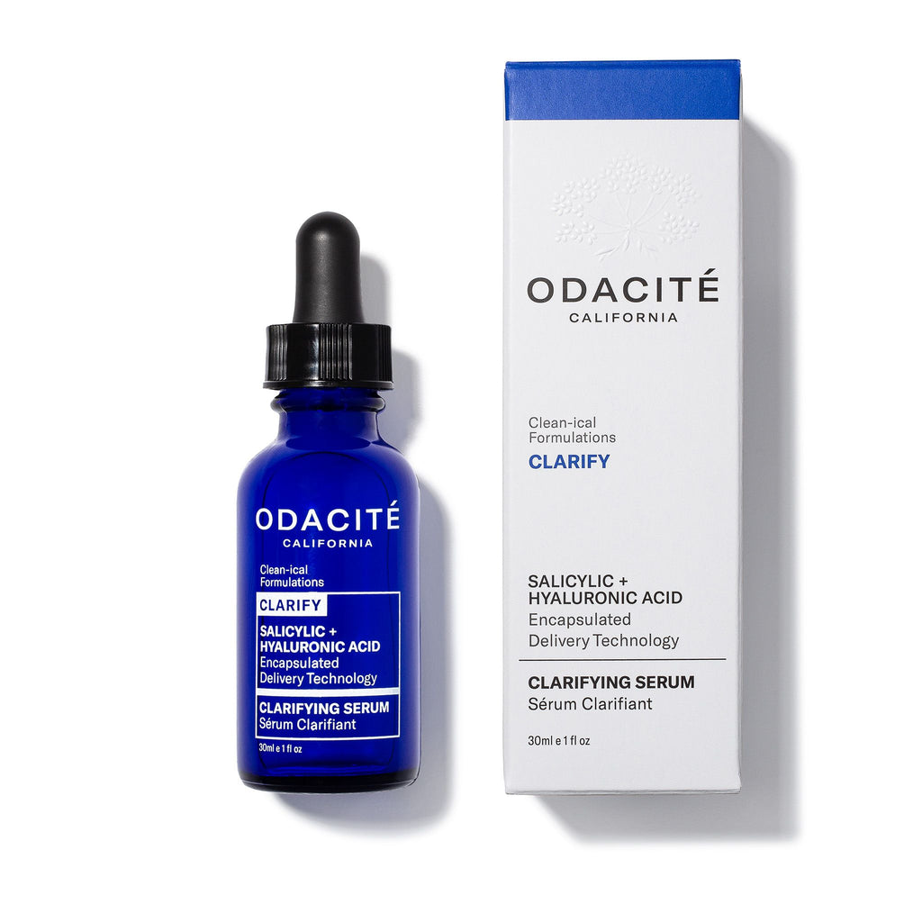Bottle of odacite clarifying serum next to its packaging.