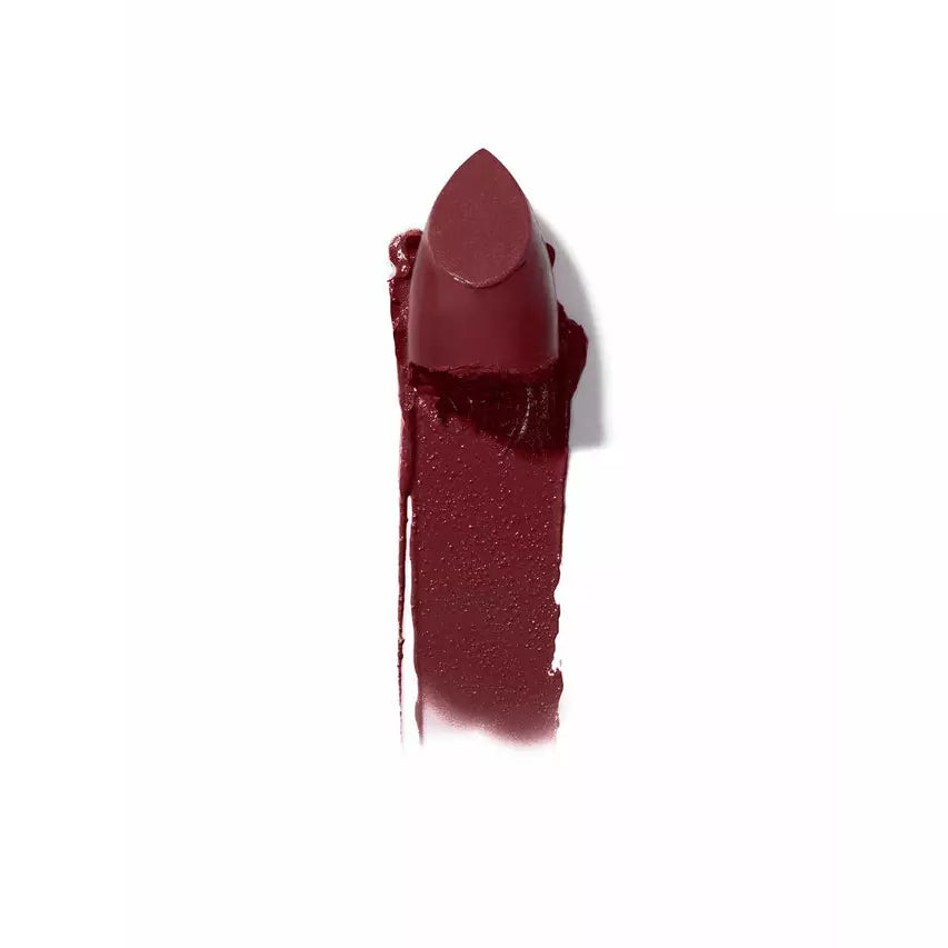 A smudged dark red lipstick on a white background.