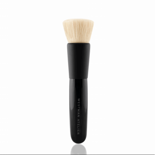 A makeup brush with a black handle on a white background.