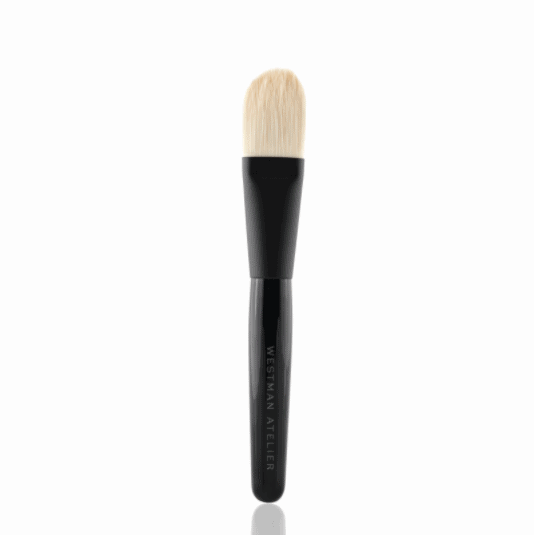 A single makeup brush with a black handle isolated on a white background.