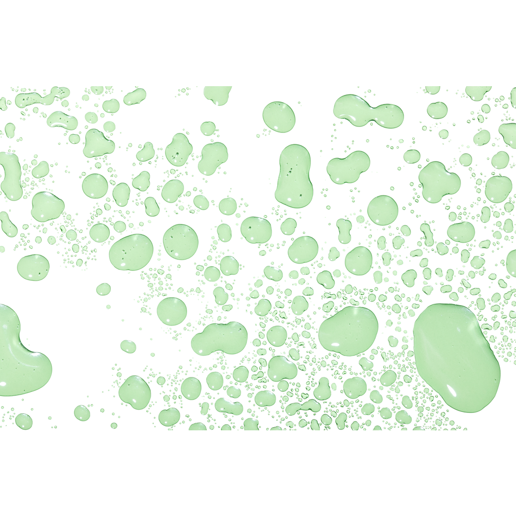 Various sizes of green paint splatters isolated on a white background.