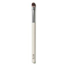 Makeup brush with white handle.