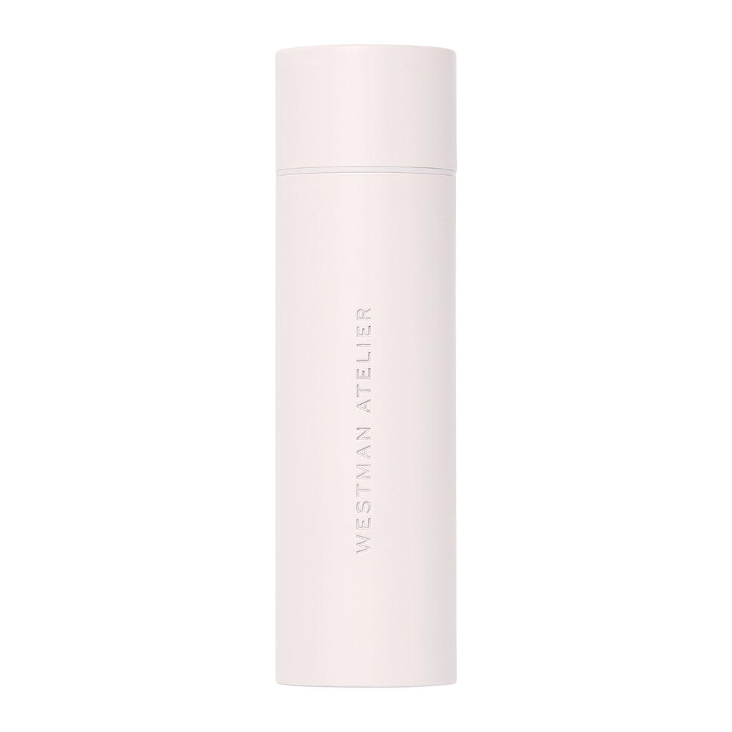 White cylindrical beauty product container with "westman atelier" branding.