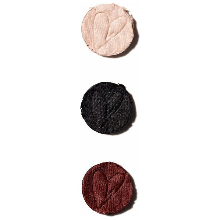 Three eyeshadow powders in beige, black, and burgundy with a heart-shaped imprint, displayed vertically on a light background.