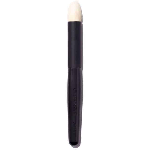 Makeup foundation brush with a black handle.