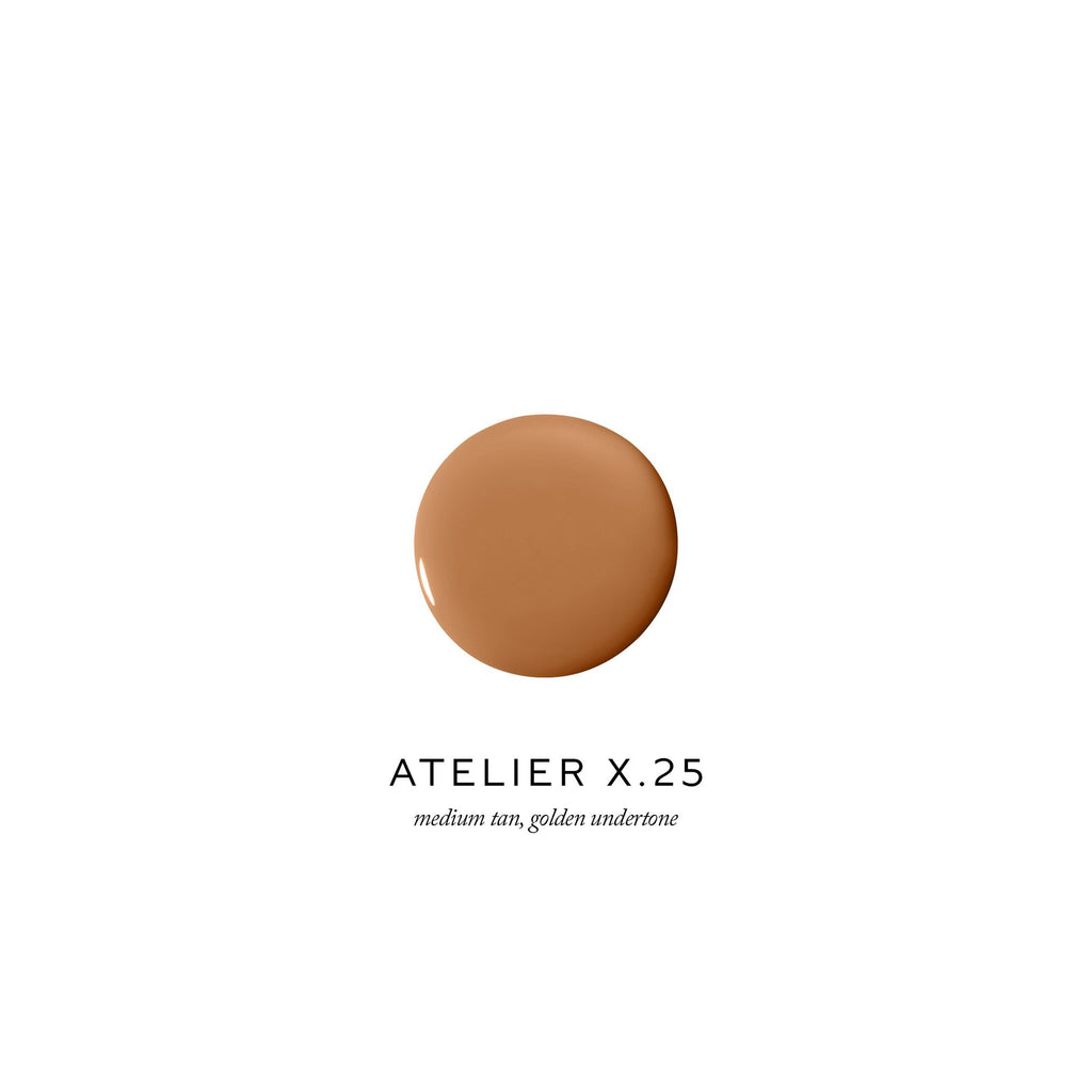 A dollop of medium tan foundation with a golden undertone, labeled "atelier x.25".