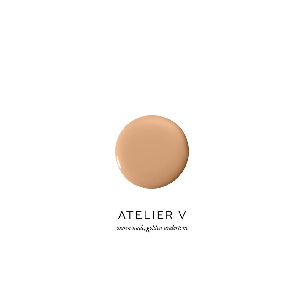 Dollop of foundation with warm nude, golden undertone, branded by atelier v.