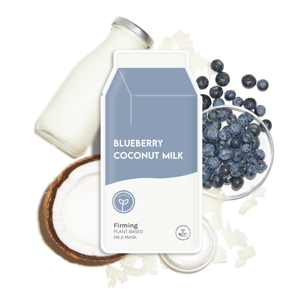 A beauty product mockup with a blueberry coconut milk theme, surrounded by related ingredients like blueberries, coconut, and milk.