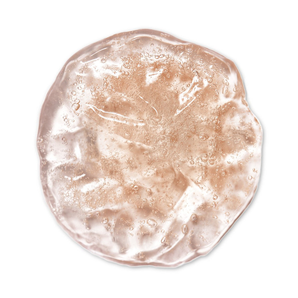A translucent brown gel with bubbles on a white background.