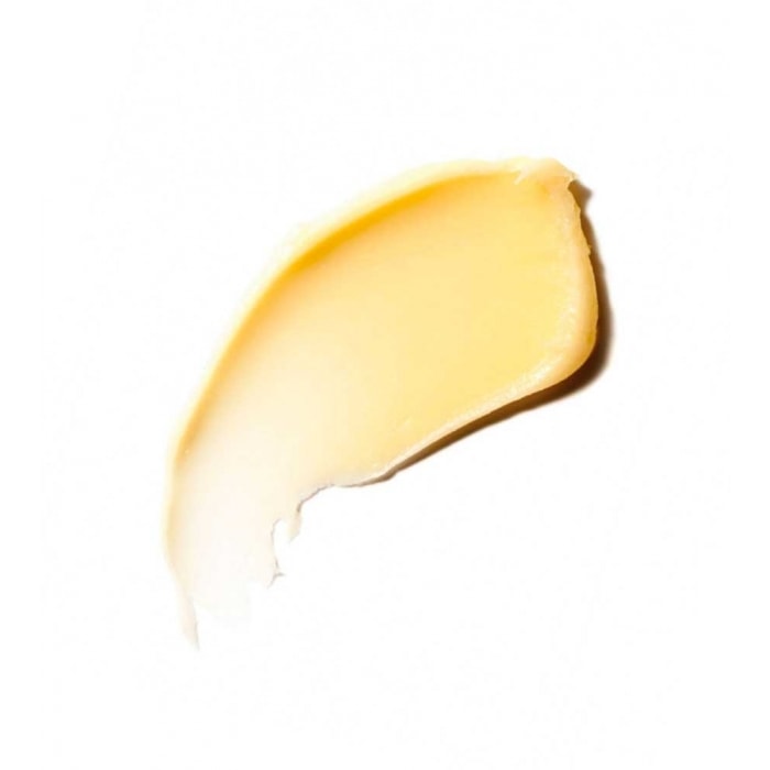 A smear of yellow cream isolated on a white background.