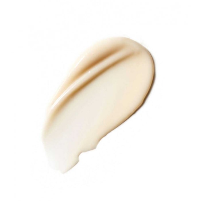 A swatch of creamy beige foundation makeup on a white background.