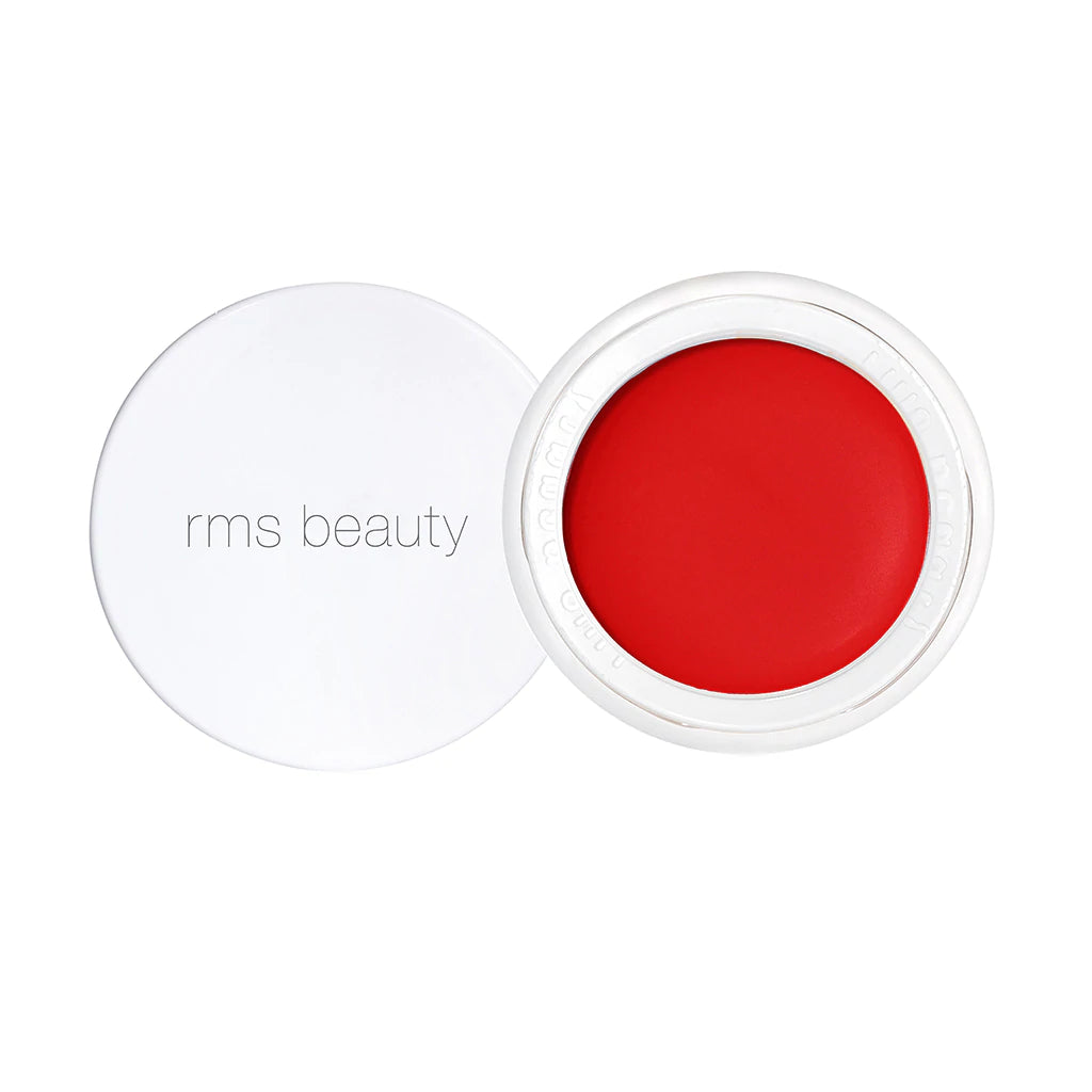 A container of rms beauty lip and cheek tint in a vibrant red shade, with the lid displayed beside it.