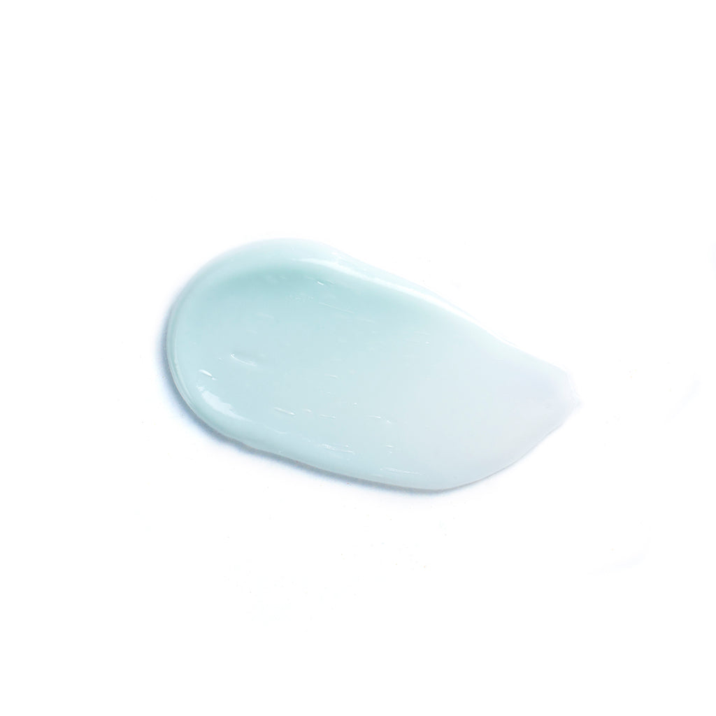 A dollop of blue translucent gel on a white background.