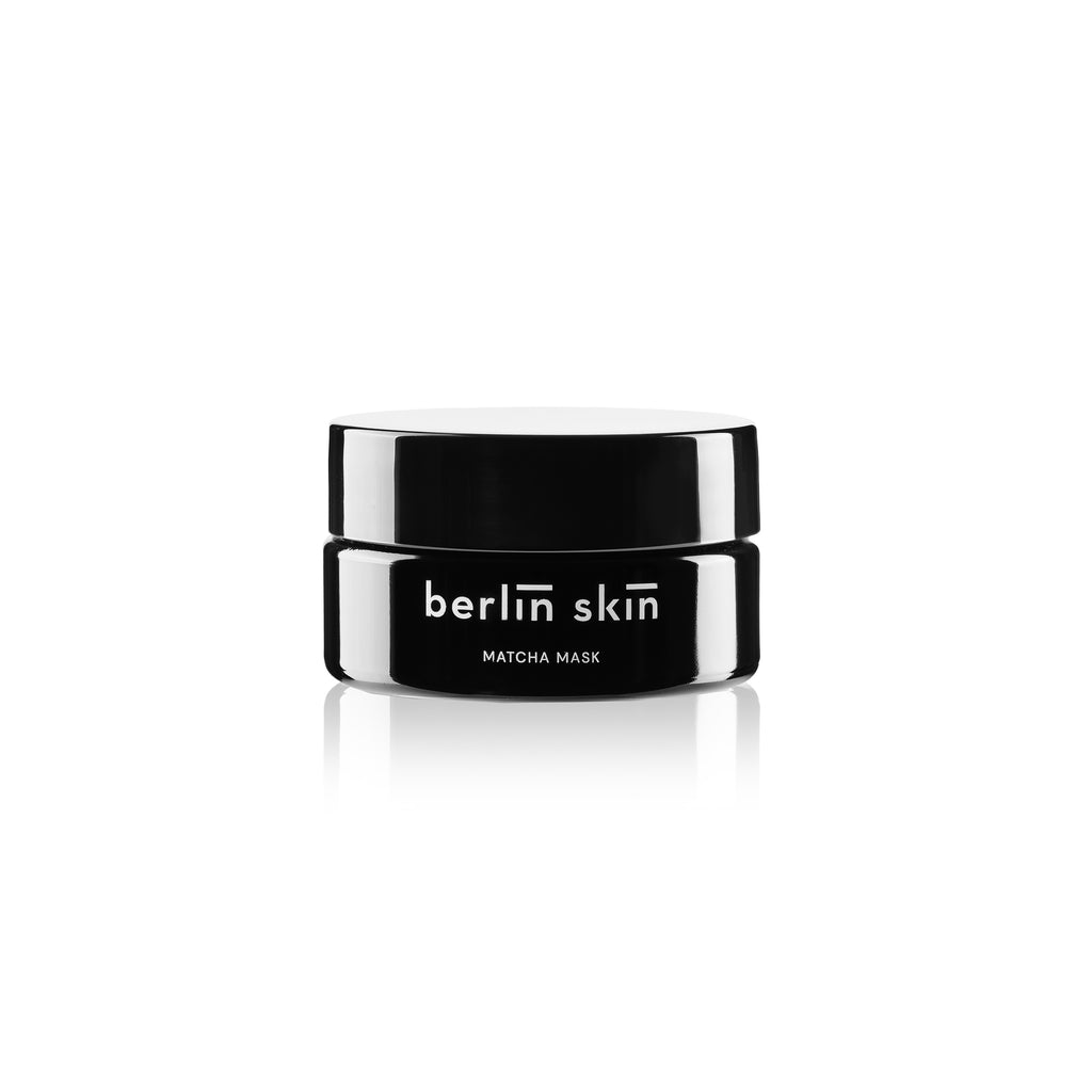 Black and white image of a berlin skin matcha mask container against a white background.