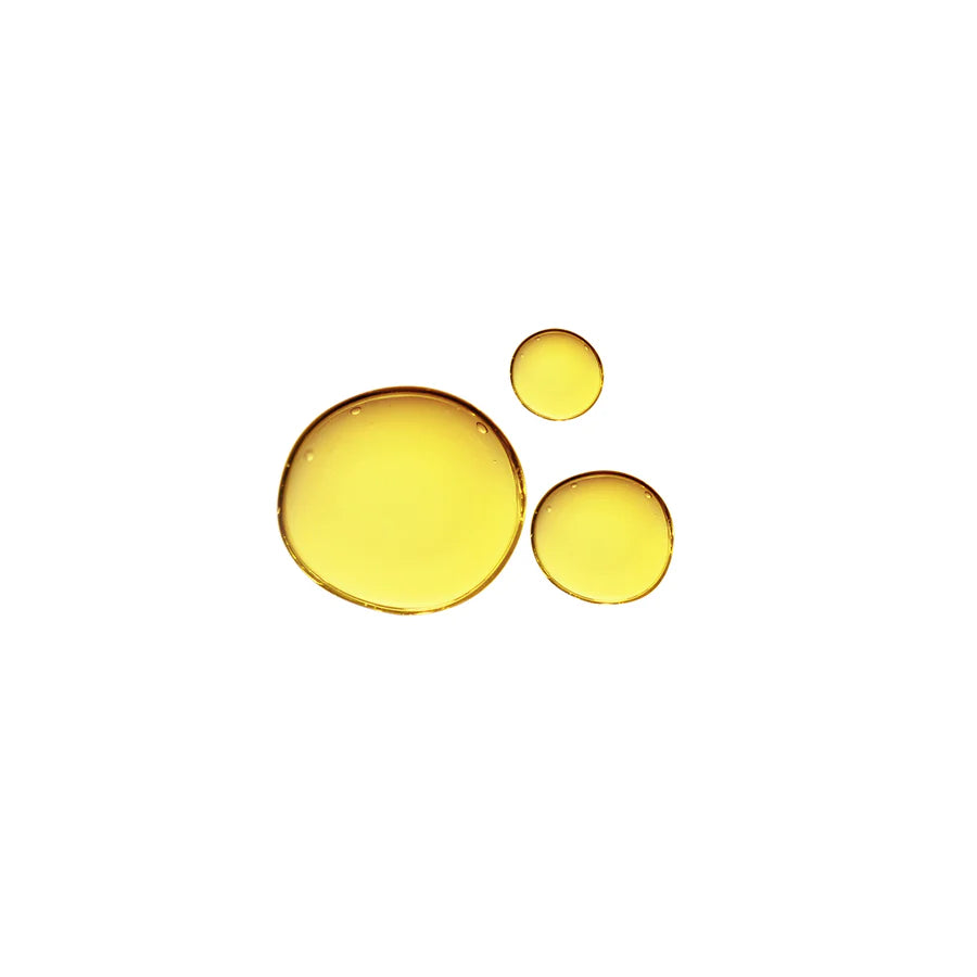 Three drops of yellow liquid on a light background, arranged in a descending size order from left to right.